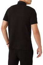 قميص بولو برقعة شعار الماركة